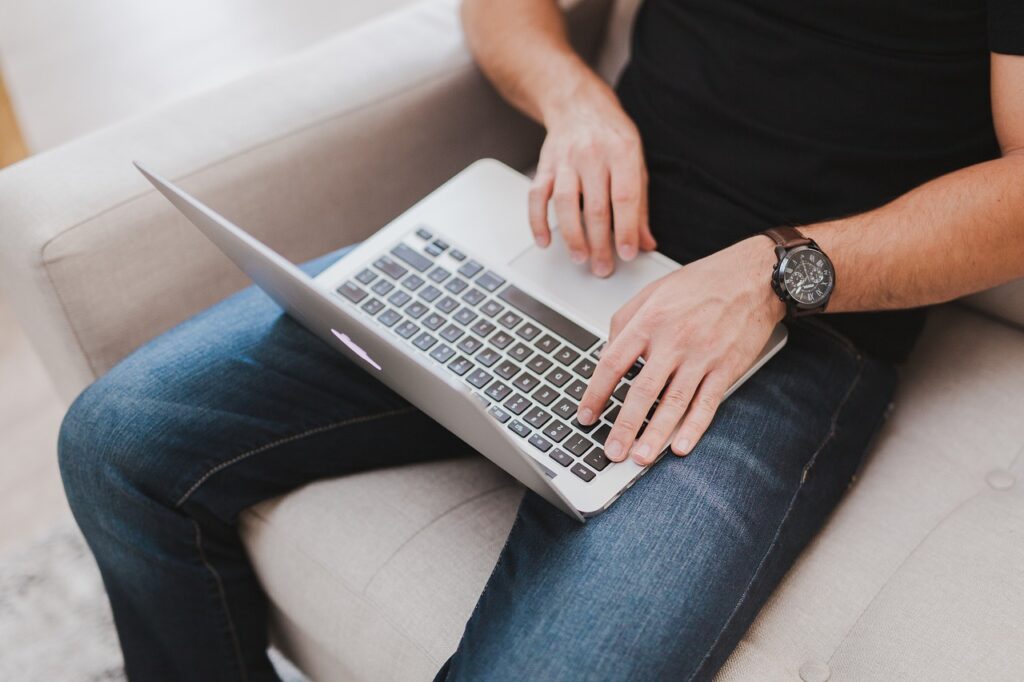 a man typing copy for a website